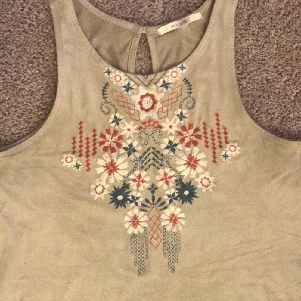 Suede, embroidered top with peephole back